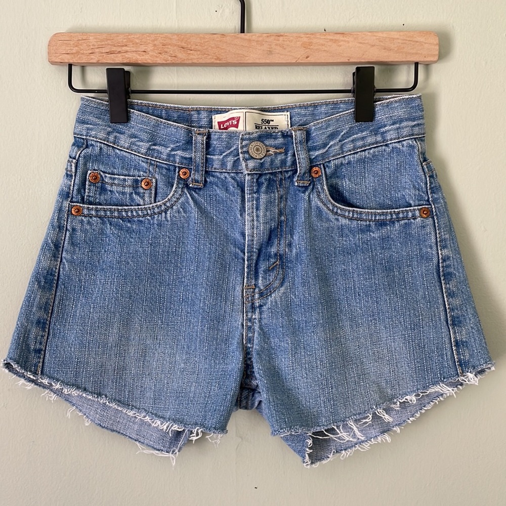 25” waist Levi’s / light wash cut-offs